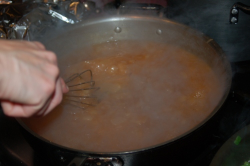 whisk roux into pan juices..