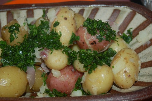 Add butter, parsley & salt to potatoes and serve with chicken (optional)